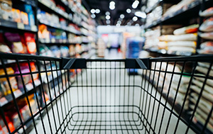 Woman reading label information in supermarket